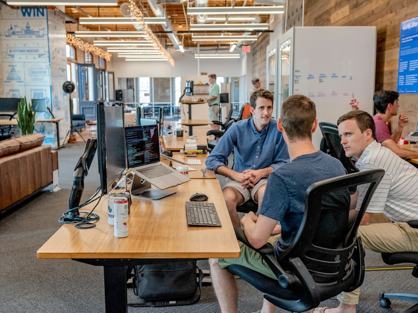 A marketing team working together on an open agency floor